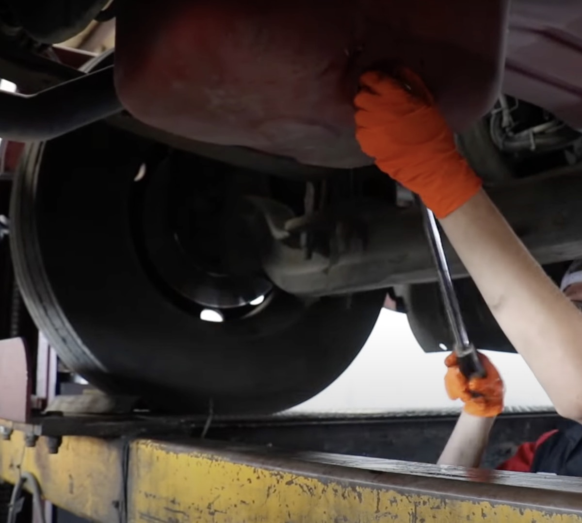 Mechanic working under a commercial truck